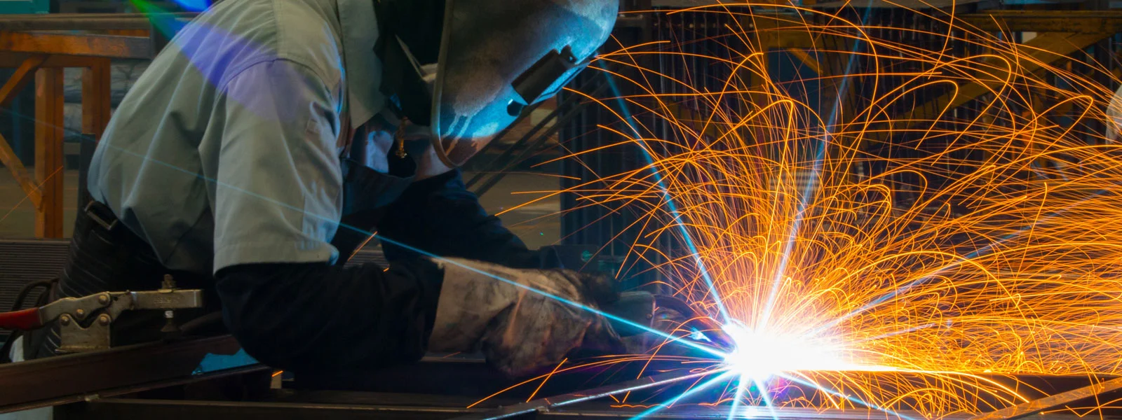 man welding with welding machine