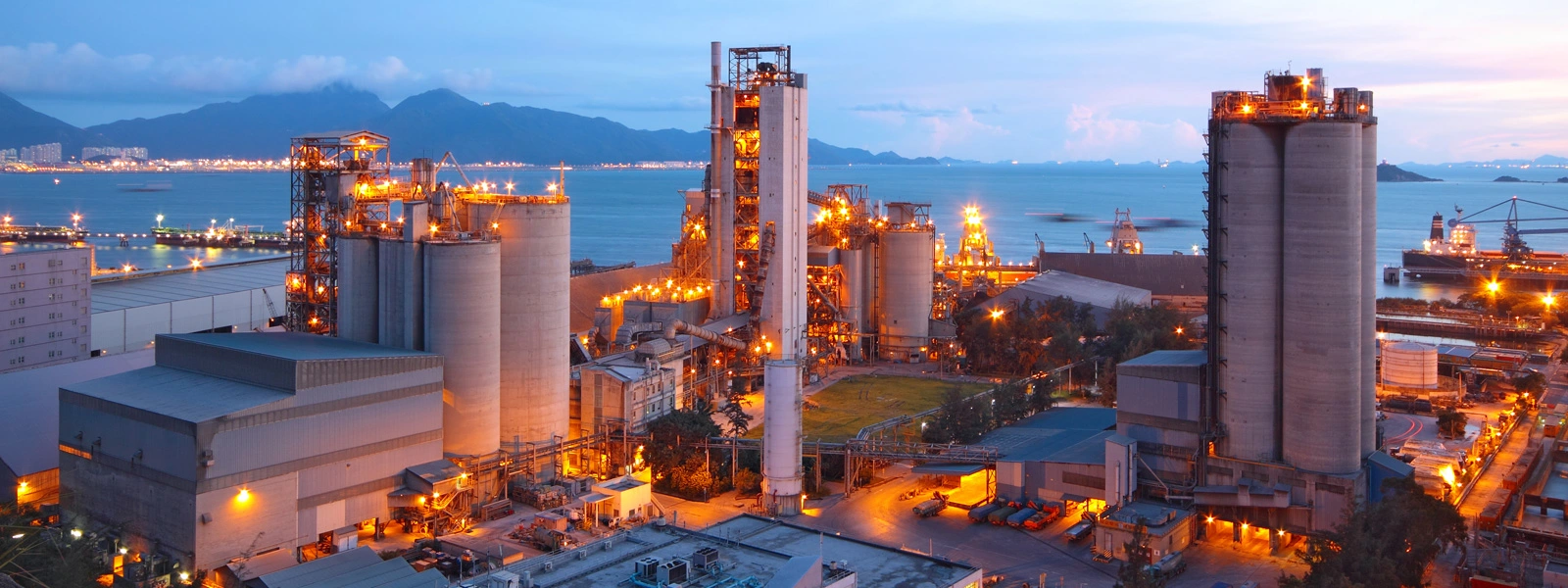 Industrial plant on the shore at sunrise